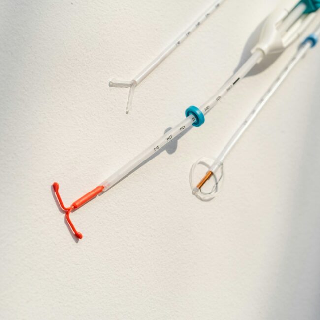 a pair of surgical instruments hanging on a wall